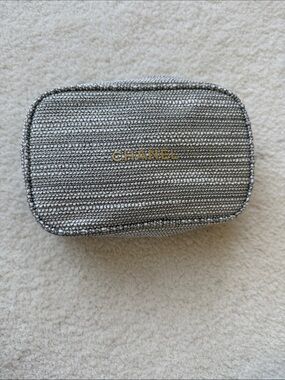 CHANEL Silver Metallic Quilted Cosmetic Case with Gold Logo